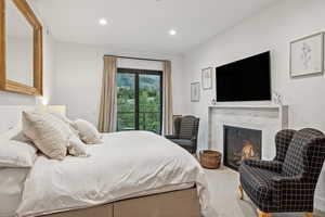 Bedroom with a premium fireplace