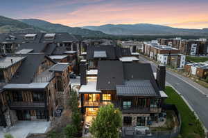 Aerial view at dusk featuring a mountain view