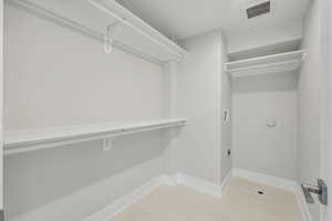 Primary Ensuite Closet with Laundry