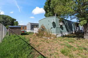 Exterior space with a storage shed