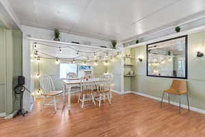 Dining space with wood-type flooring