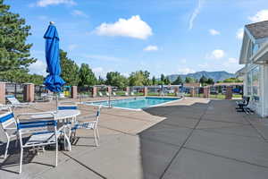 View of pool featuring a patio area and a mountain view