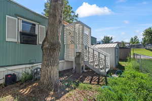 Exterior space featuring a shed