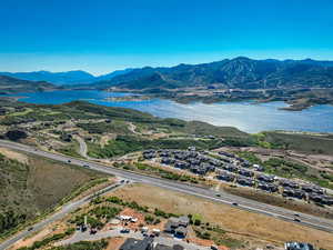 Aerial view featuring a water and mountain view