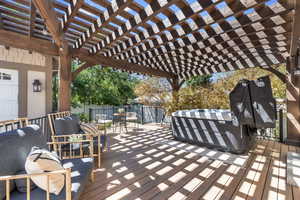 Deck featuring a pergola