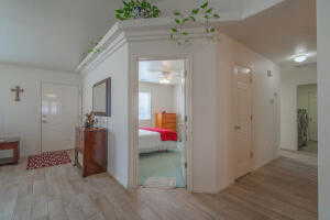 Hallway with light hardwood / wood-style floors