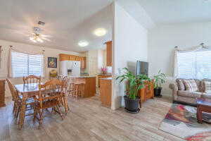 Dining room with ceiling fan and light hardwood / wood-style floors