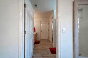 Corridor featuring hardwood / wood-style flooring