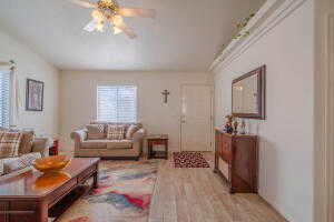 Living room featuring light hardwood / wood-style flooring and ceiling fan