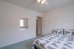 Bedroom with carpet flooring and ceiling fan