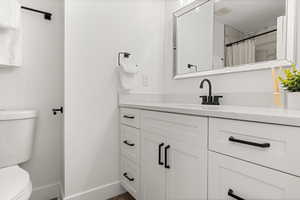 Bathroom with vanity and toilet