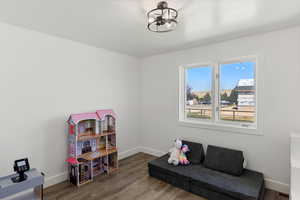 Living area featuring wood-type flooring