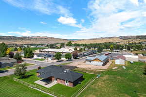 Birds eye view of property with a mountain view