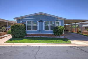 View of front facade with a carport