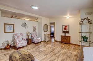 Living area with light hardwood / wood-style floors