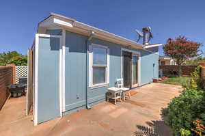 Rear view of house featuring a patio area