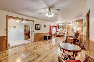 Interior space with ceiling fan and light wood-type flooring