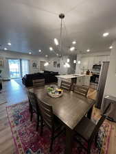 Dining room featuring a notable chandelier and light hardwood / wood-style floors