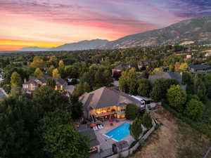 Aerial view at dusk featuring a mountain view