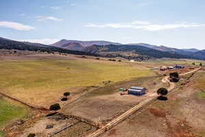 Birds eye view of property featuring a rural view and a mountain view