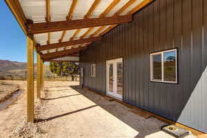 View of patio / terrace with a mountain view and french doors