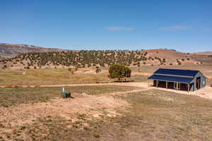 Property view of mountains with a rural view