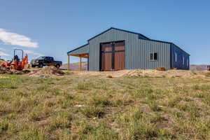 View of outbuilding featuring a garage