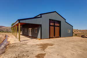 View of outbuilding with a garage