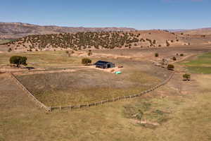 Birds eye view of property with a rural view and a mountain view