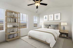 Carpeted bedroom with ceiling fan and vaulted ceiling