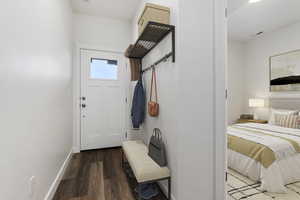 Mudroom with dark hardwood / wood-style floors