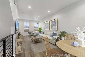 Living room with hardwood / wood-style flooring and a fireplace