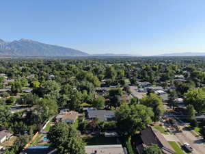 Birds eye view of property with a mountain view