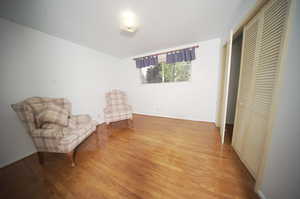 Bedroom or Sitting room with light wood-type flooring