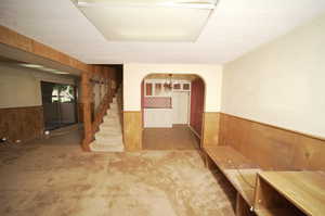 Interior space with wood walls and carpet