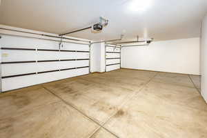 Garage featuring a garage door opener