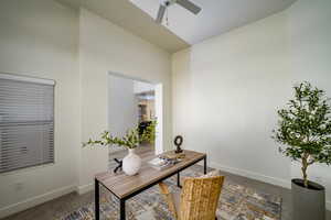 Office with ceiling fan and carpet floors