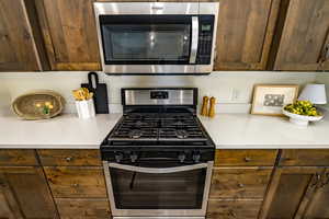 Kitchen featuring appliances with stainless steel finishes