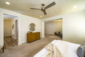 Bedroom with ceiling fan and carpet floors