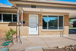 Property entrance with a patio