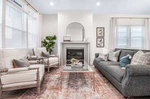 Living room featuring a wealth of natural light and hardwood / wood-style flooring