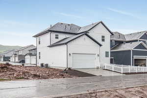 View of side of home featuring a garage