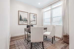 Dining area with wood-type flooring