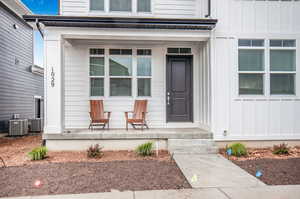 Doorway to property with cooling unit