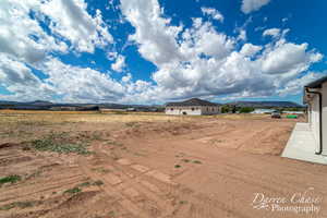 Charming Farmhouse with Stunning Mountain Views | Backyard Looking to the Southwest