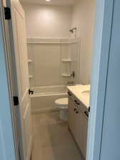 Upstairs Full bathroom with vanity, toilet,  shower combination, and tile patterned floors