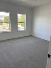 Master Bedroom looking toward two windows