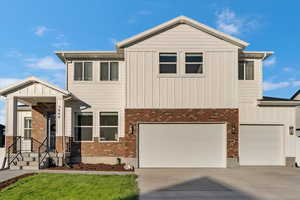 View of front facade featuring a garage