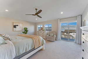 Bedroom with light colored carpet, access to exterior, and ceiling fan