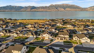 Birds eye view of property featuring a water and mountain view